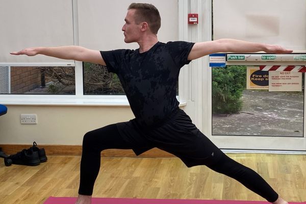 A man doing a yoga pose