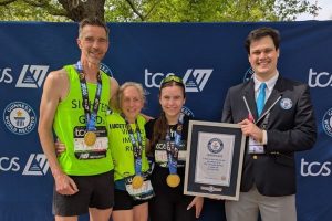 Derek, Lucy and her daughter with their world record certificate.