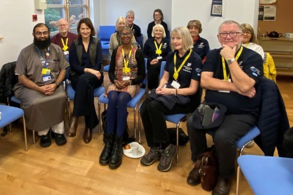 Rizwan and our volunteers sitting in a group.