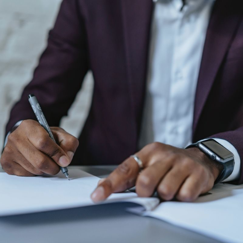 A man signing a piece of paper